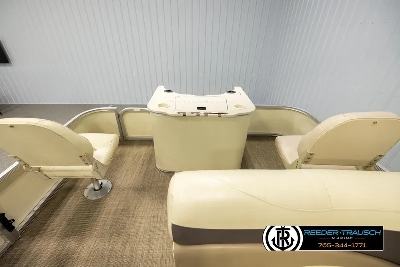 Slide: The Image of 2008 Bennington 2050 FSI boat interior with beige seating and console. - 15