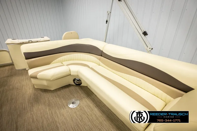 Slide: The Image of 2008 Bennington 2050 FSI boat interior with beige and brown seating. - 19