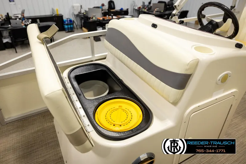Slide: The Image of 2008 Bennington 2050 FSI boat interior with seating and storage compartment. - 23
