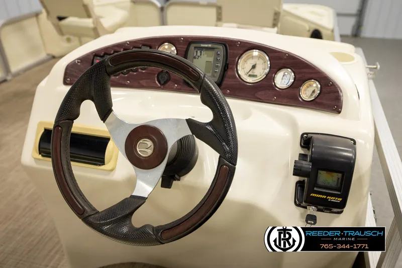 Slide: The Image of Steering console of 2008 Bennington 2050 FSI boat with gauges and controls. - 25
