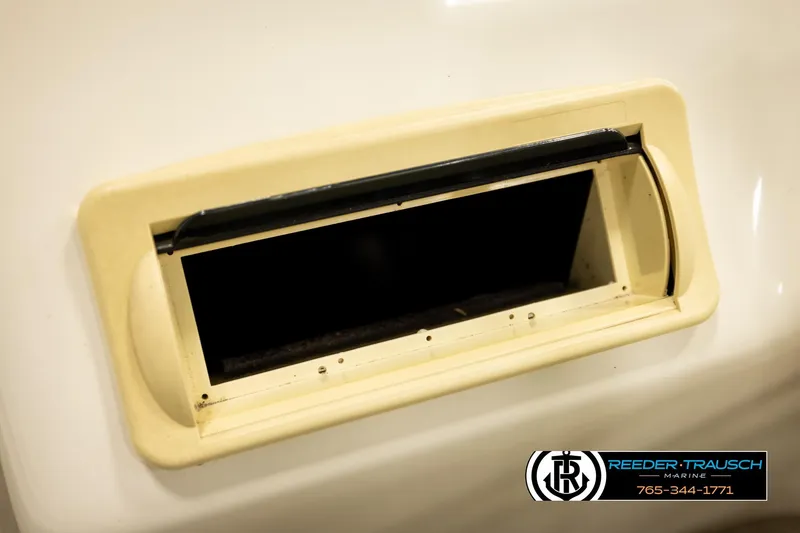Slide: The Image of Close-up of a 2008 Bennington 2050 FSI boat vent with Reeder-Trausch Marine logo. - 28