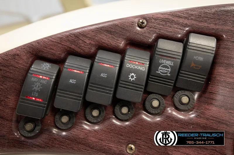 Slide: The Image of Control panel of a 2008 Bennington 2050 FSI boat with labeled switches. - 29