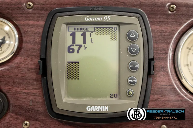 Slide: The Image of Garmin 95 depth finder on 2008 Bennington 2050 FSI boat dashboard, showing 11 ft depth. - 31