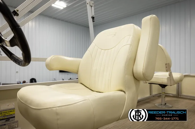 Slide: The Image of Cream-colored captain's chair on 2008 Bennington 2050 FSI boat, indoor setting. - 39