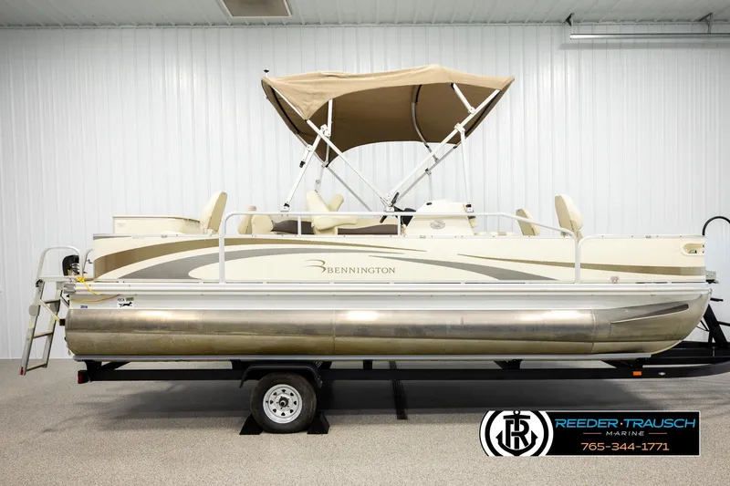 Slide: The Image of 2008 Bennington 2050 FSI pontoon boat with canopy in indoor showroom. - 5