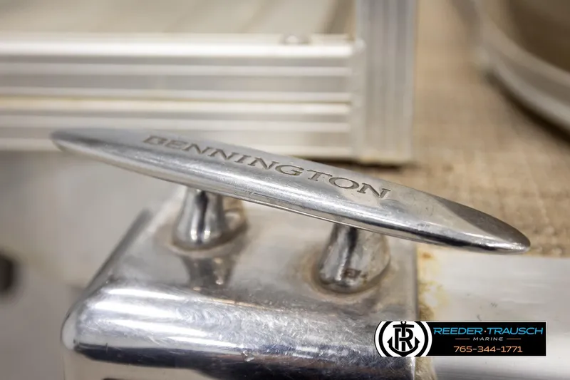 Slide: The Image of Close-up of a 2008 Bennington 2050 FSI boat cleat with engraved branding. - 50