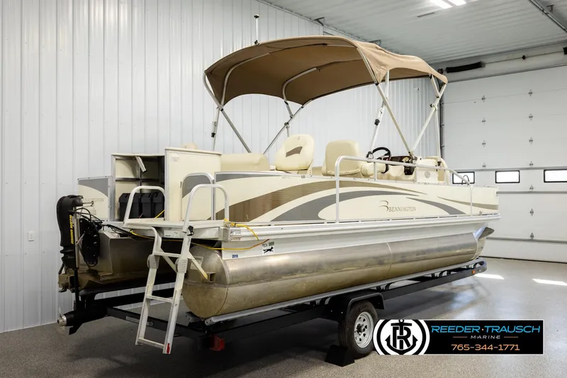Slide: The Image of 2008 Bennington 2050 FSI pontoon boat with canopy in indoor storage. - 6