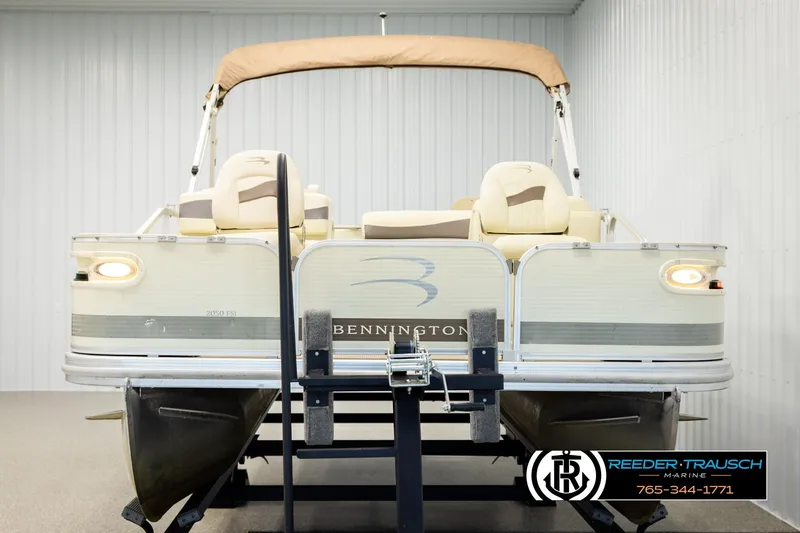 Slide: The Image of 2008 Bennington 2050 FSI pontoon boat on trailer in indoor storage. - 8