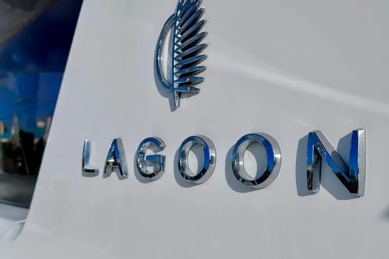 Slide: The Image of Chrome "Lagoon" logo on 2024 Lagoon 42 yacht exterior. - 35