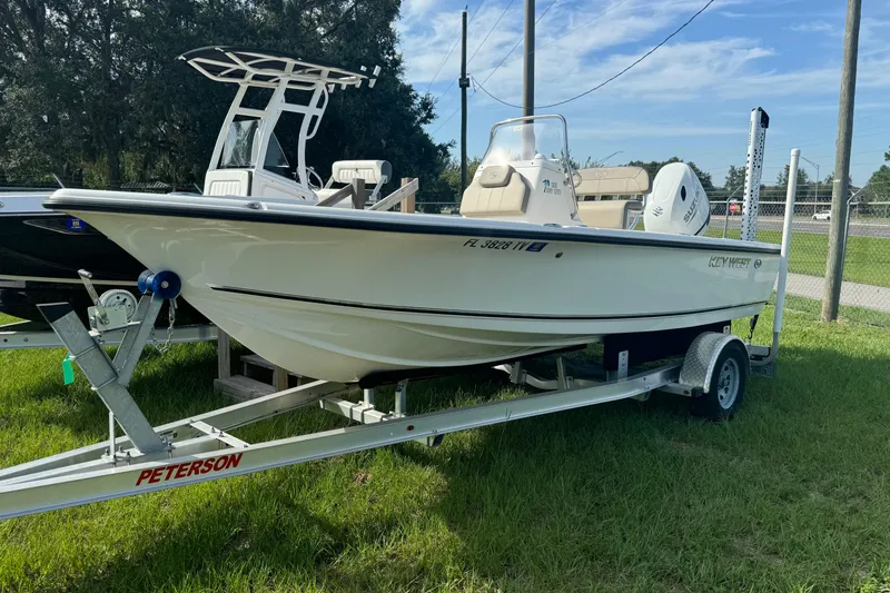The Image of 2024 Key West 188 Bay Reef boat on trailer, parked on grass. - 0