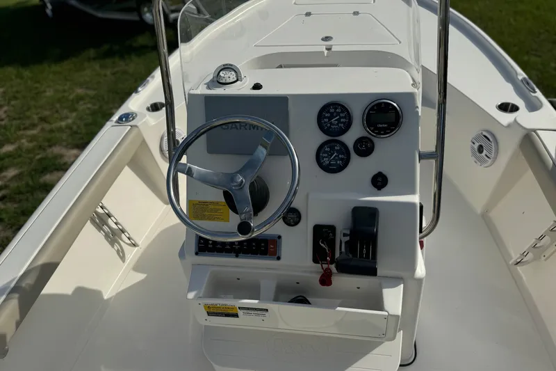 Slide: The Image of 2024 Key West 188 Bay Reef boat dashboard with steering wheel and gauges. - 5