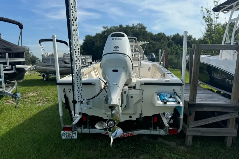 Slide: The Image of 2024 Key West 188 Bay Reef boat on trailer, rear view, parked on grass. - 9
