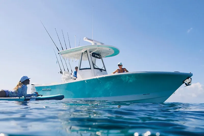 The Image of 2023 Regulator 28 boat in showroom, featuring dual engines and sleek design. - 0