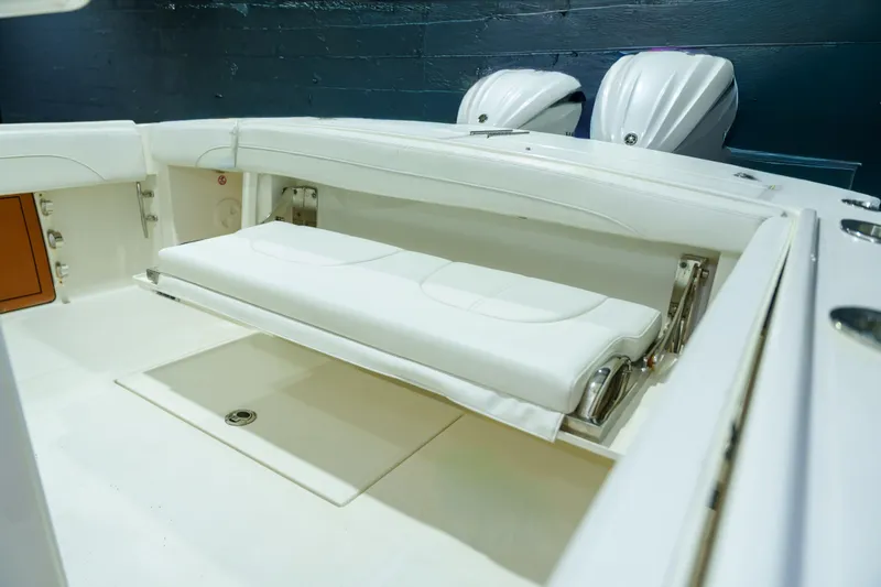 Slide: The Image of 2023 Regulator 28 boat interior with rod holders and storage compartments. - 15