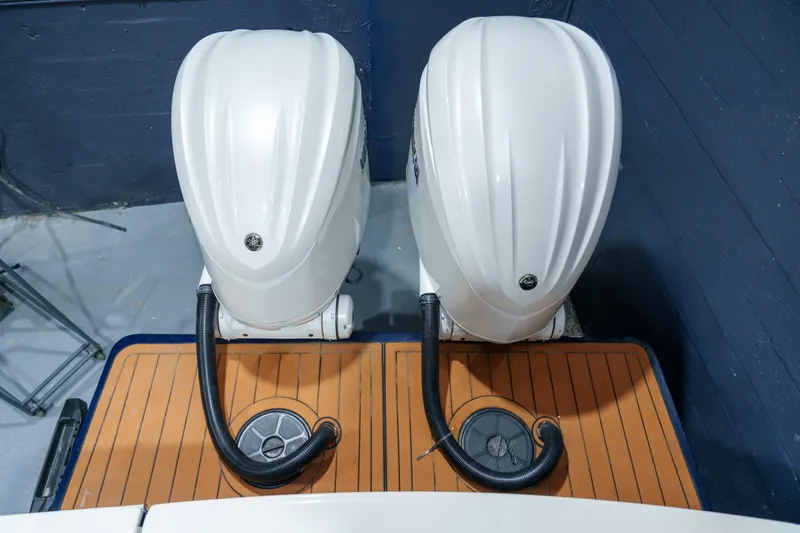 Slide: The Image of 2023 Regulator 28 boat interior, showcasing sleek white design and wood accents. - 18