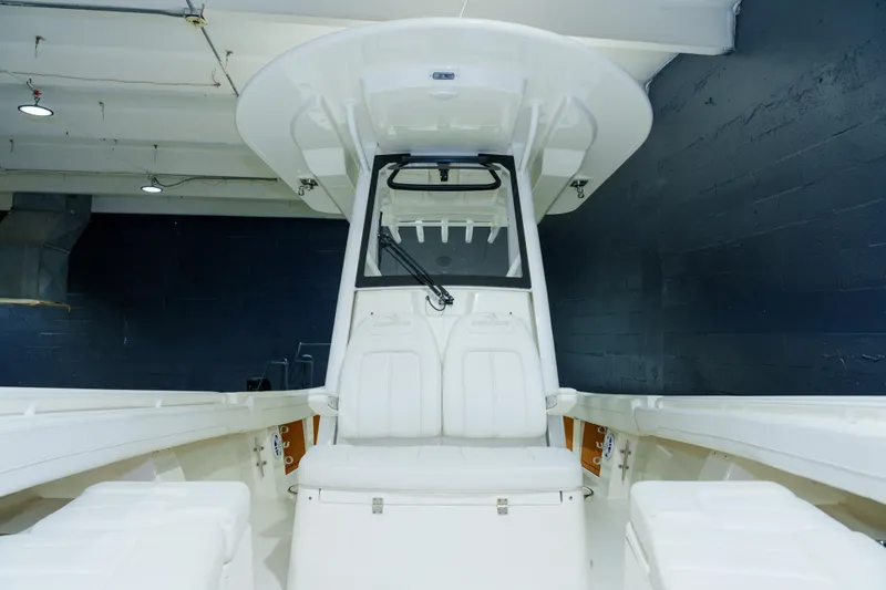 Slide: The Image of 2023 Regulator 28 boat interior with open storage compartment, showcasing sleek design. - 23