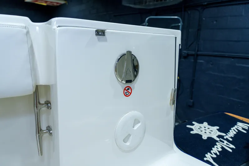 Slide: The Image of 2023 Regulator 28 boat dashboard with Garmin navigation system and steering wheel. - 34