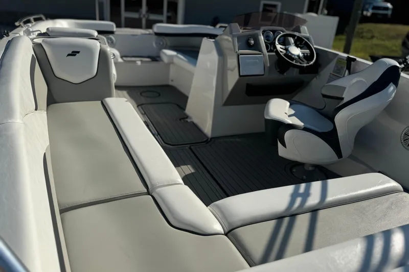 Slide: The Image of 2022 Starcraft SVX 191 OB boat interior with seating and steering console. - 11