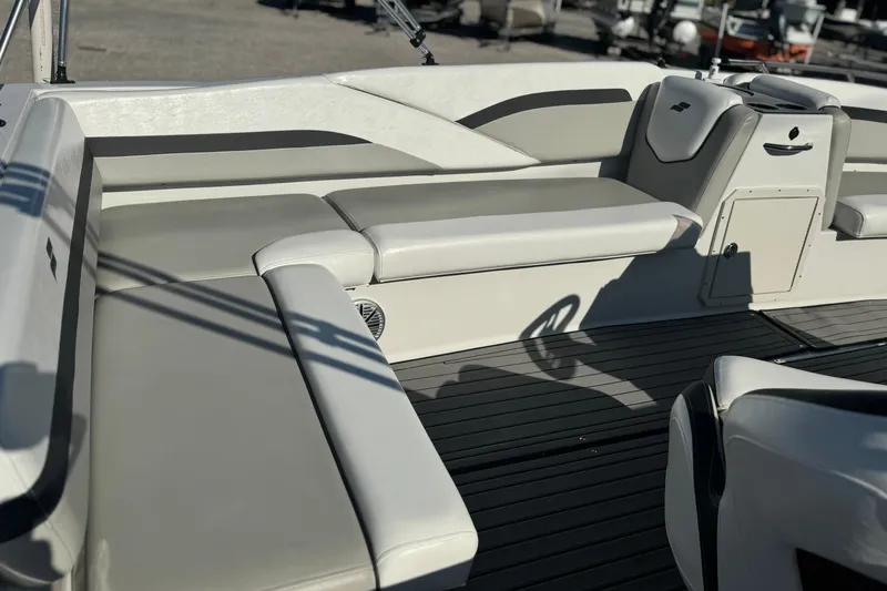 Slide: The Image of 2022 Starcraft SVX 191 OB boat interior with cushioned seating and sleek design. - 5