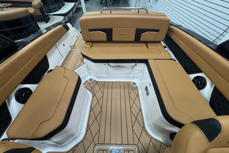 Slide: The Image of Luxurious interior of 2026 Chaparral 6 SSX boat with tan seating and sleek design. - 12