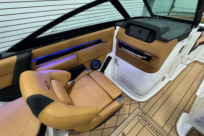 Slide: The Image of 2026 Chaparral 6 SSX interior with tan leather seats and sleek dashboard design. - 19