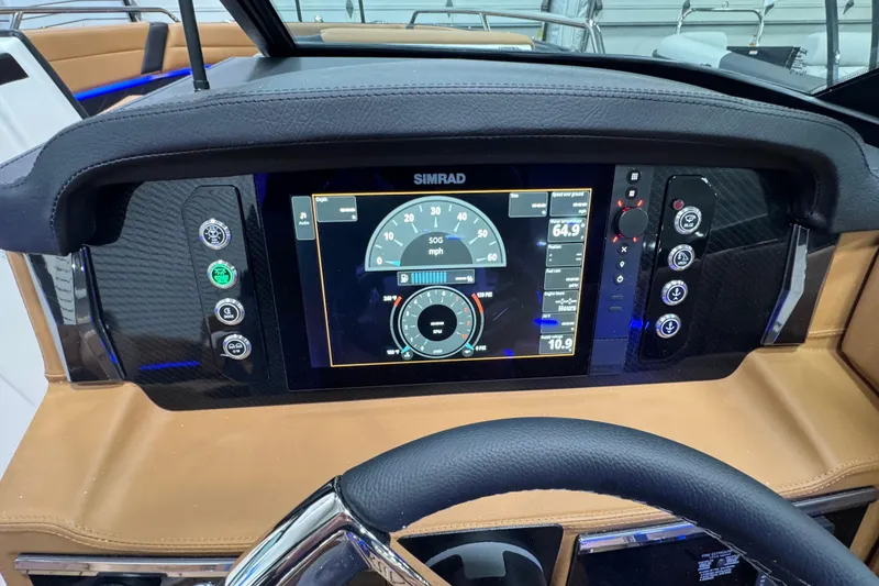 Slide: The Image of Dashboard of 2026 Chaparral 6 SSX boat with Simrad display and controls. - 21