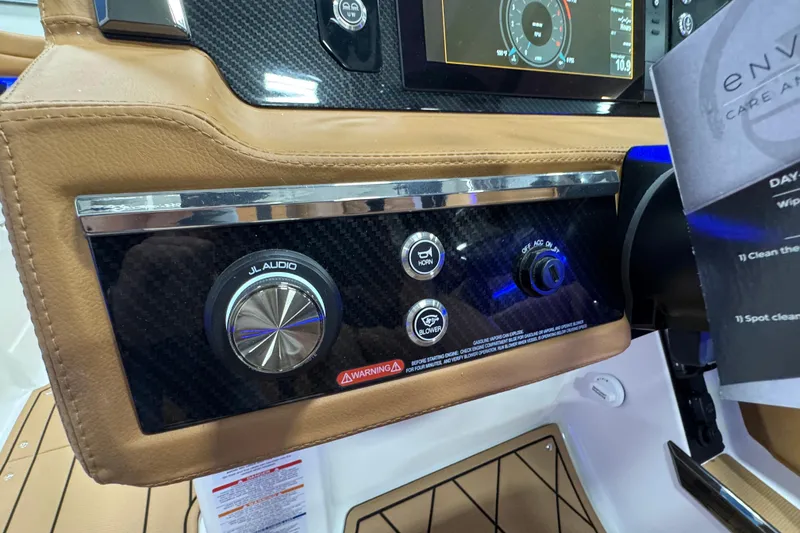 Slide: The Image of 2026 Chaparral 6 SSX dashboard with JL Audio controls and carbon fiber accents. - 22