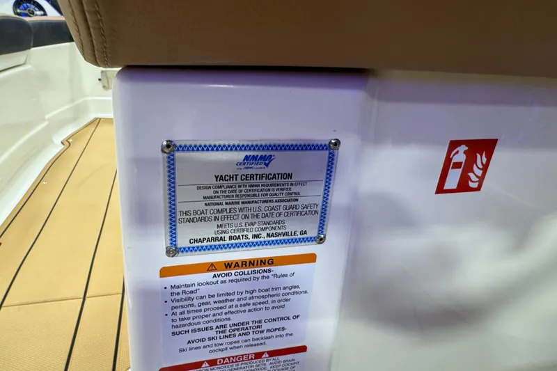 Slide: The Image of 2026 Chaparral 6 SSX yacht certification and safety warning labels. - 26