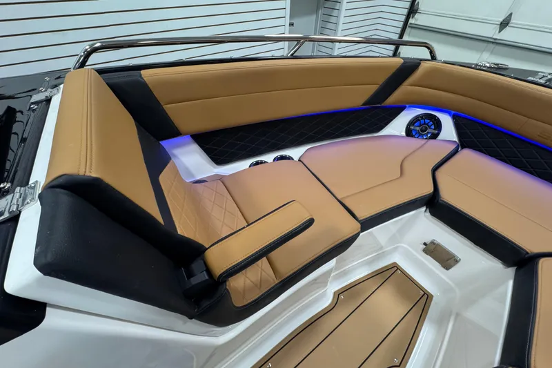 Slide: The Image of Luxurious interior of 2026 Chaparral 6 SSX boat with tan and black seating. - 32