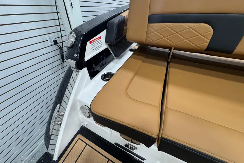 Slide: The Image of 2026 Chaparral 6 SSX boat interior with tan leather seating and modern design. - 8