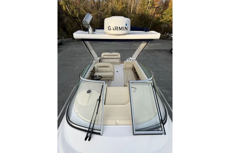 Slide: The Image of 2019 Regal 28 Express boat with Garmin equipment, featuring spacious seating and sleek design. - 17