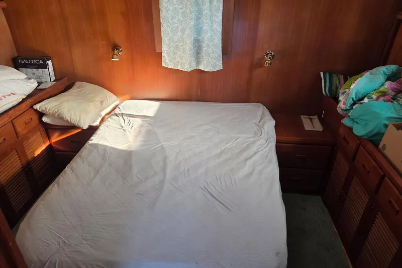 Slide: The Image of Cozy bedroom in 1988 Novamarine 36 Heritage East Trawler with wooden interior and bed. - 11
