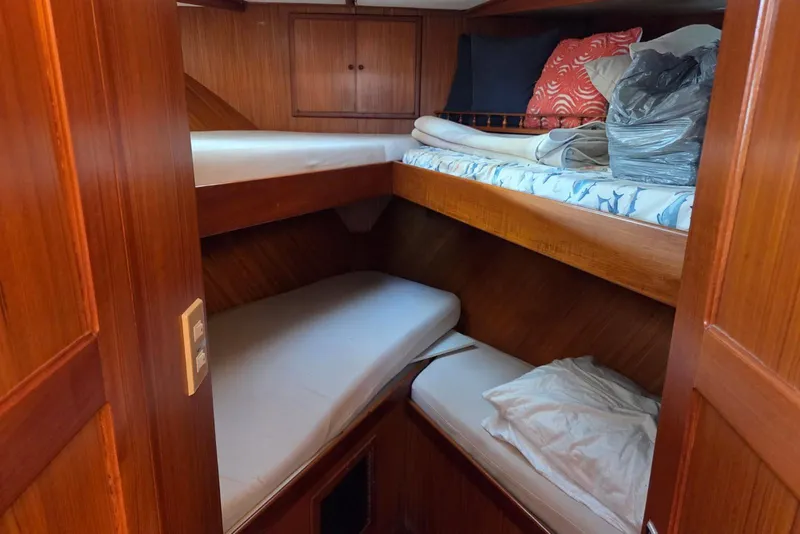 Slide: The Image of 1988 Novamarine 36 Heritage East Trawler cabin with wooden interior and bunk beds. - 12