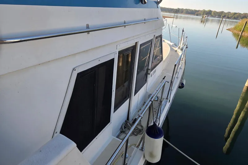 Slide: The Image of 1988 Novamarine 36 Heritage East Trawler docked on calm water. - 17