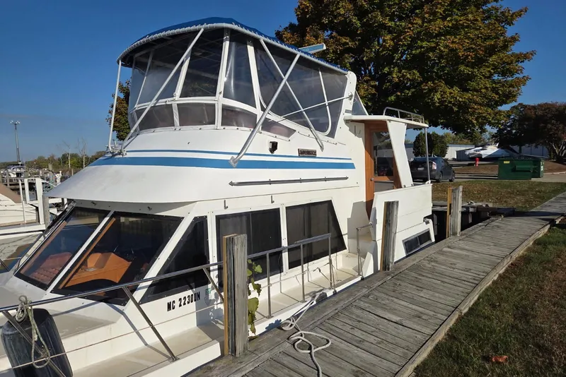 Slide: The Image of 1988 Novamarine 36 Heritage East Trawler docked by a wooden pier. - 3