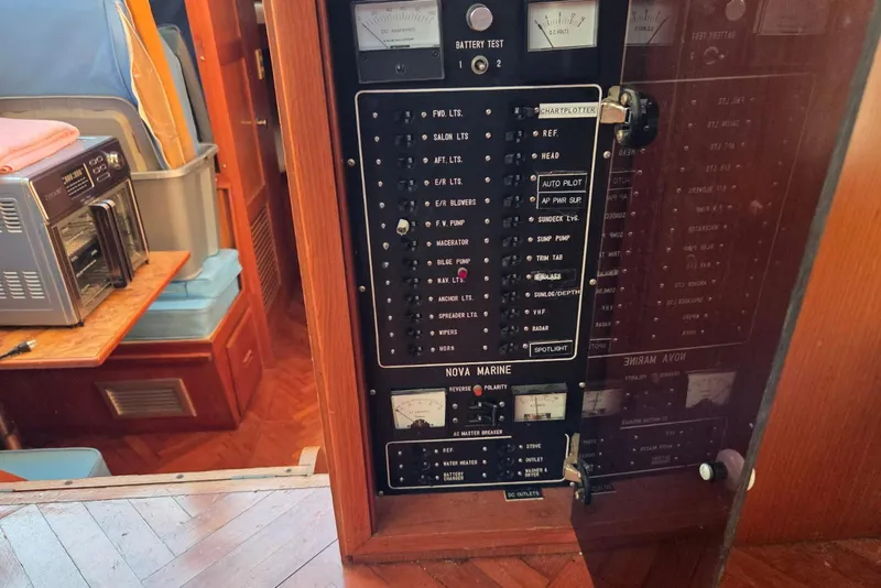 Slide: The Image of Control panel of a 1988 Novamarine 36 Heritage East Trawler, featuring various switches and gauges. - 7