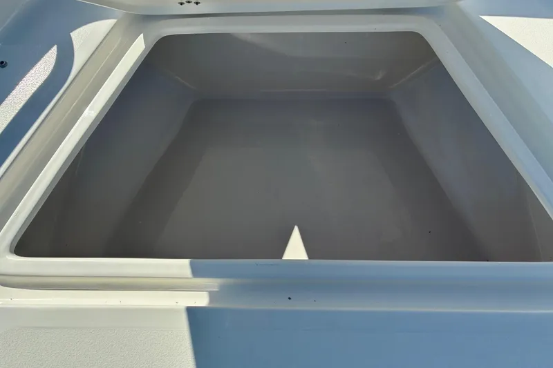 Slide: The Image of Open storage compartment on 2026 Key West 189 FS boat. - 15