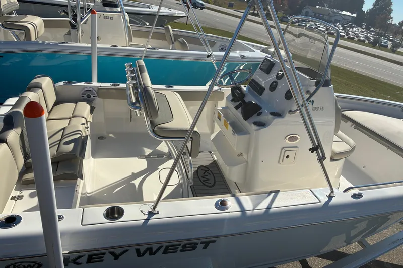 Slide: The Image of 2026 Key West 189 FS boat interior with seating and control console. - 6