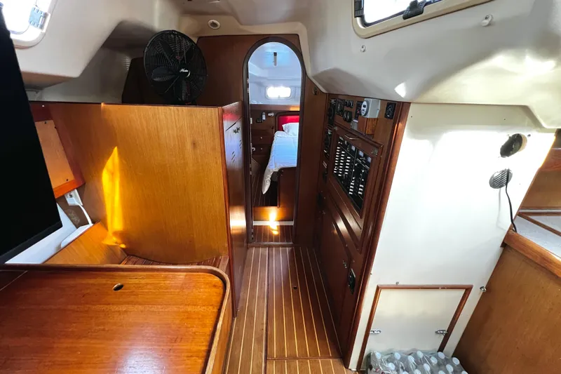 Slide: The Image of Interior of 1999 Hunter Passage 420 yacht with control panel and cozy bedroom. - 21