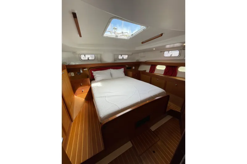 Slide: The Image of Interior of 1999 Hunter Passage 420 sailboat with wooden cabinetry and cozy cabin. - 22