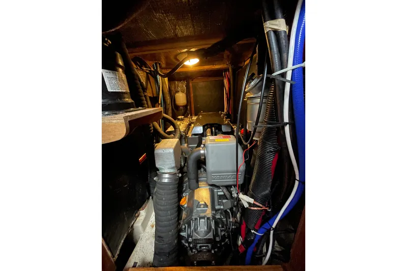 Slide: The Image of Interior of a 1999 Hunter Passage 420 yacht with control panels and seating area. - 33