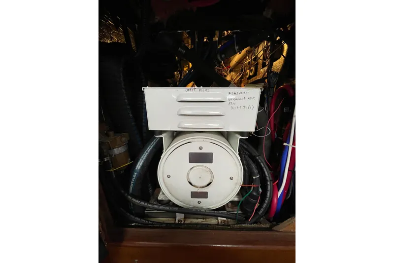 Slide: The Image of Interior of 1999 Hunter Passage 420 yacht with cozy seating and wooden accents. - 34