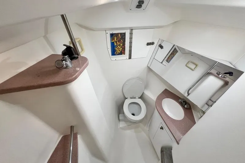 Slide: The Image of Bathroom interior of 1999 Hunter Passage 420 yacht with toilet and sink. - 38