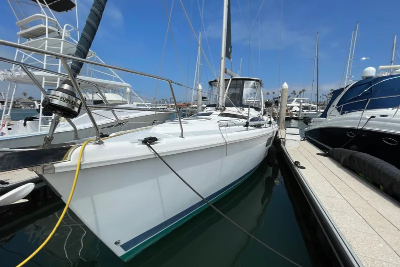 Slide: The Image of 1999 Hunter Passage 420 sailboat cockpit with protective canopy and sleek design. - 4