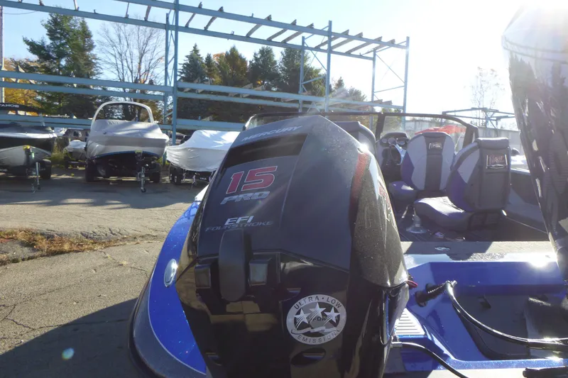 Slide: The Image of 2026 Ranger 621FS Pro boat with 15 Pro EFI engine in a marina setting. - 10