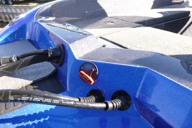 Slide: The Image of 2026 Ranger 621FS Pro boat interior with blue metallic finish and control panel. - 15