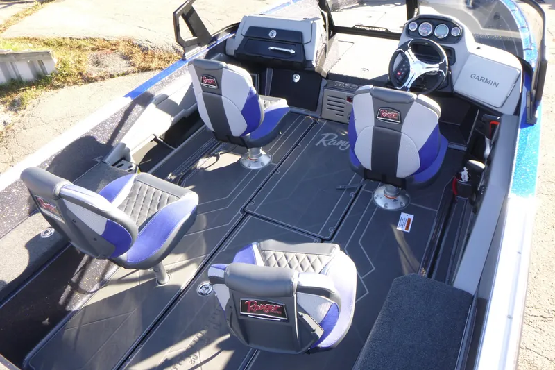 Slide: The Image of 2026 Ranger 621FS Pro boat interior with four seats and Garmin dashboard. - 16