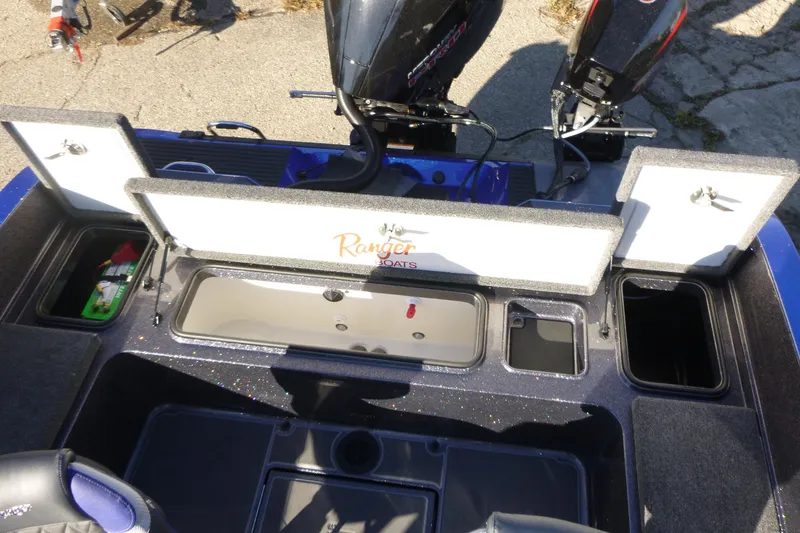 Slide: The Image of 2026 Ranger 621FS Pro boat interior with storage compartments and dual motors. - 18