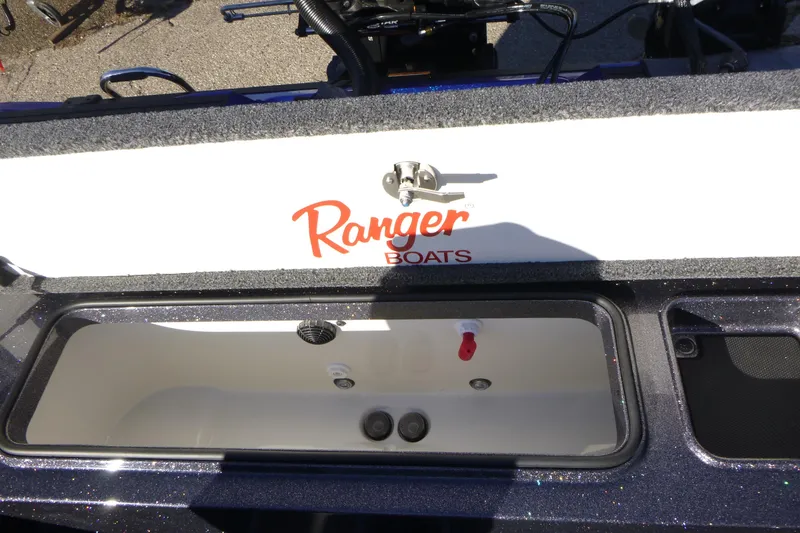 Slide: The Image of 2026 Ranger 621FS Pro boat livewell with logo, open lid, and interior view. - 19