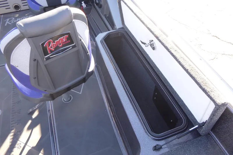 Slide: The Image of 2026 Ranger 621FS Pro boat interior with storage compartment and branded seat. - 20